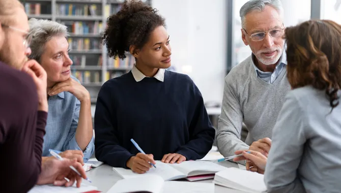 Instructional coach working with a teacher in a classroom