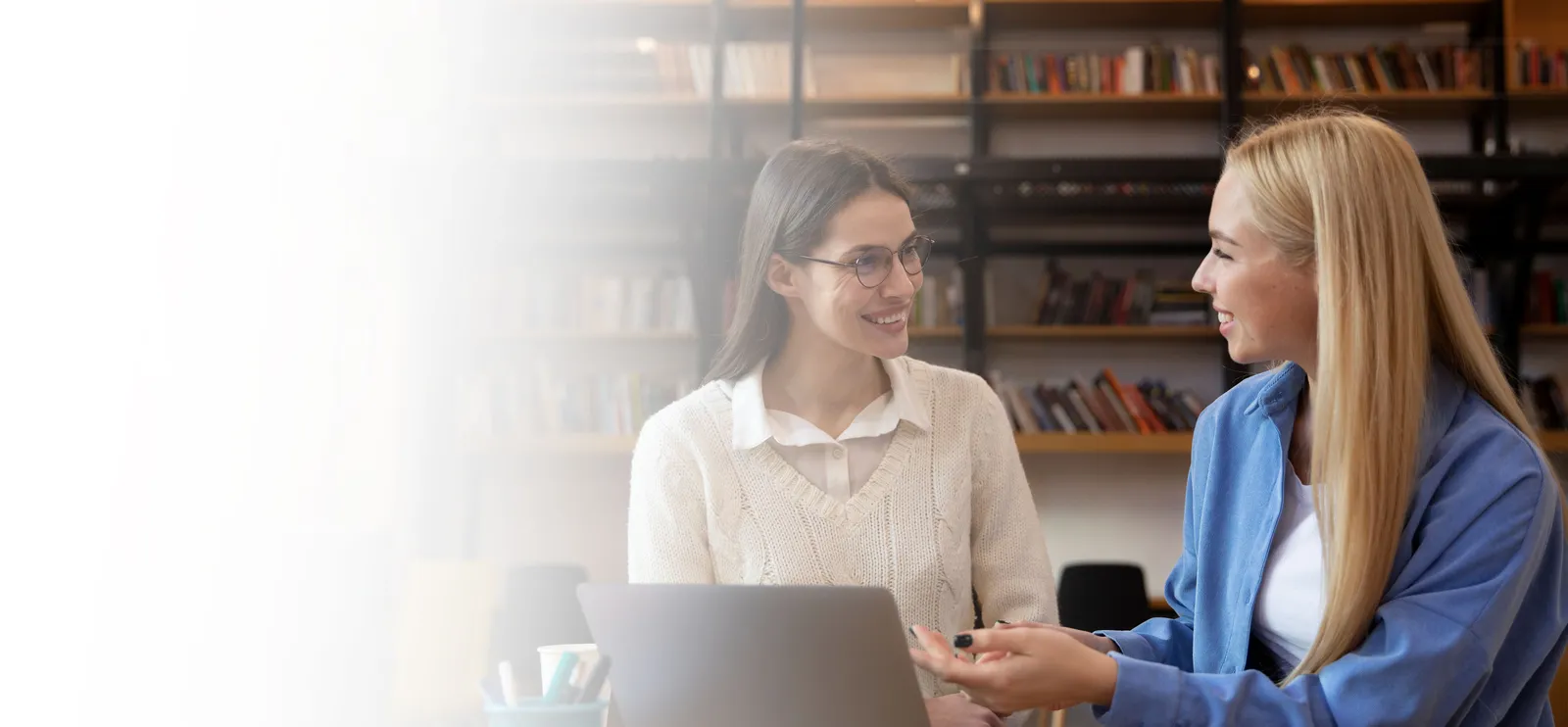 Two educators in a thoughtful professional conversation